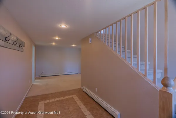 a view of a hallway with staircase