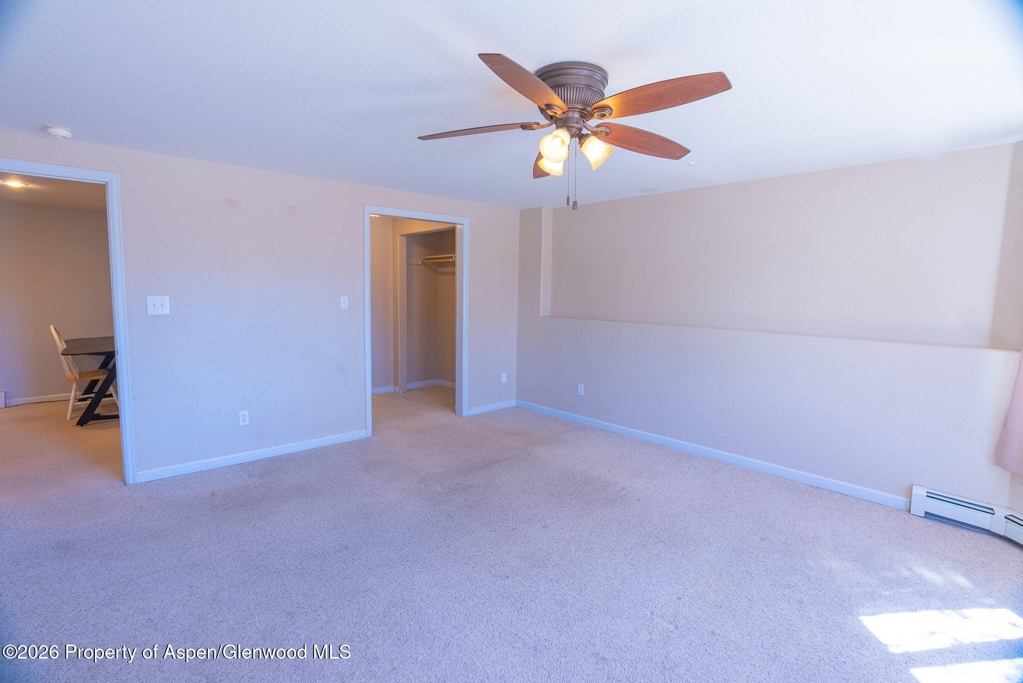 1558 East 12th Street Rifle, CO 81650 - Photo 5 of 25 an empty room with closet and fan