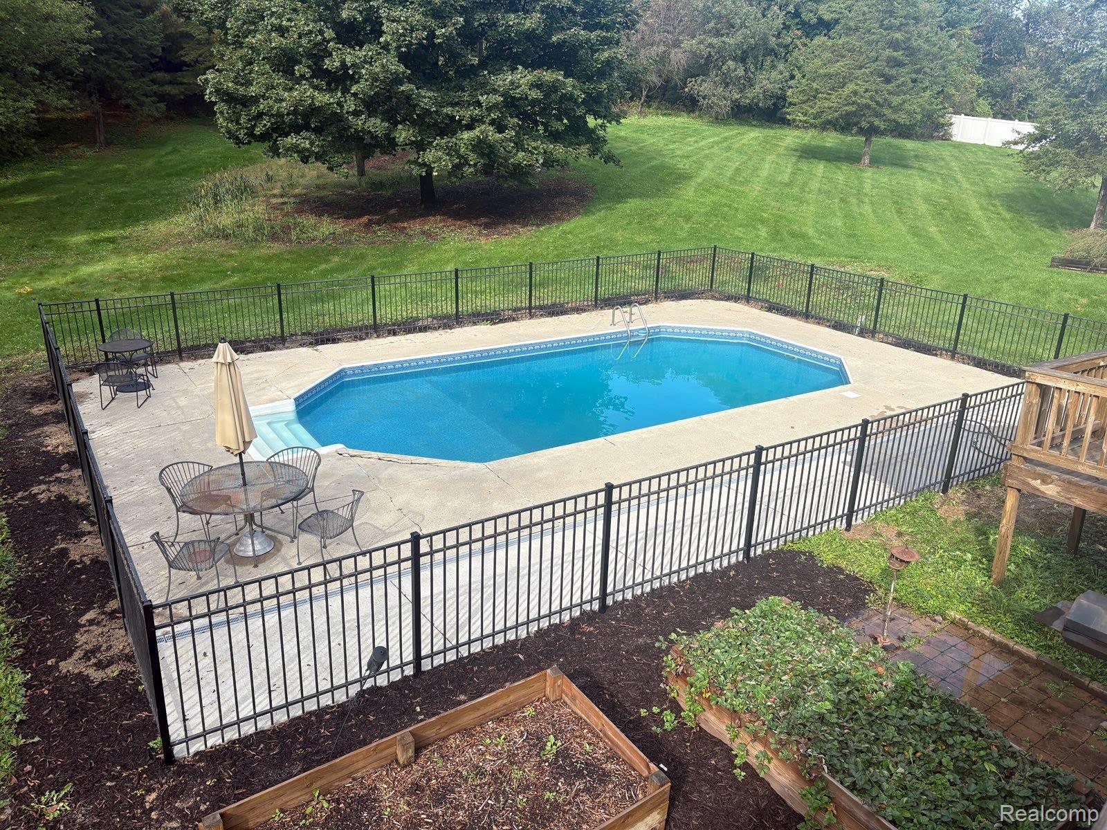 8114 Chilson Road Pinckney, MI 48169 - Photo 3 of 33 New fenced in pool area