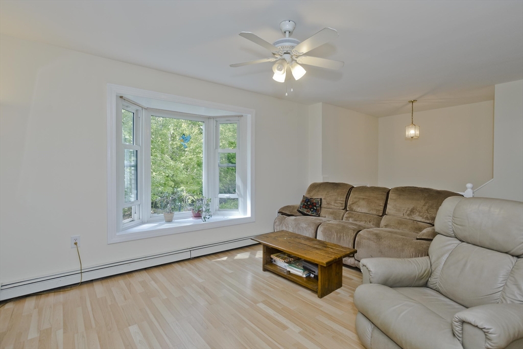 85 Damon Pond Road Chesterfield, MA 01012 - Photo 11 of 42 a living room with furniture and a large window