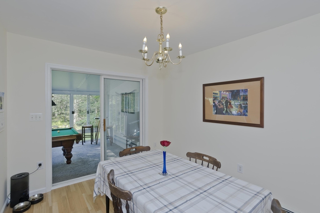 85 Damon Pond Road Chesterfield, MA 01012 - Photo 14 of 42 a bedroom with furniture and a chandelier