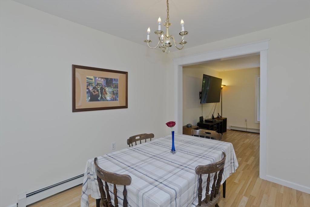85 Damon Pond Road Chesterfield, MA 01012 - Photo 15 of 42 a view of a dining room with furniture and wooden floor
