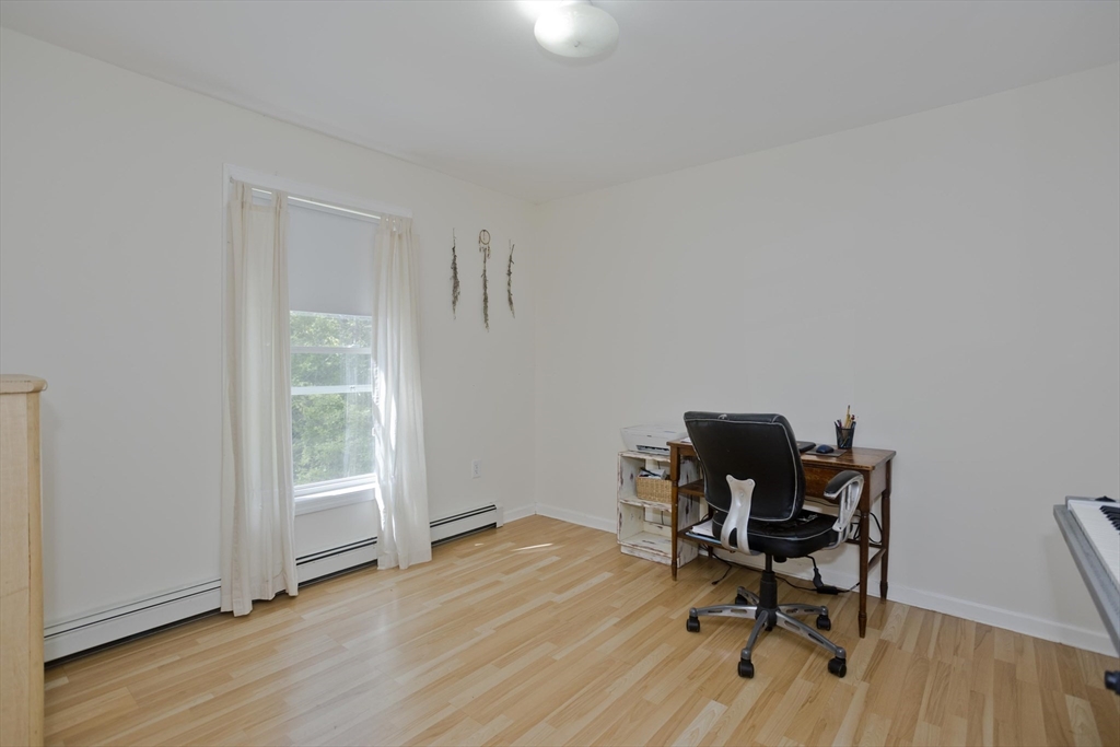 85 Damon Pond Road Chesterfield, MA 01012 - Photo 16 of 42 a workspace with furniture and wooden floor