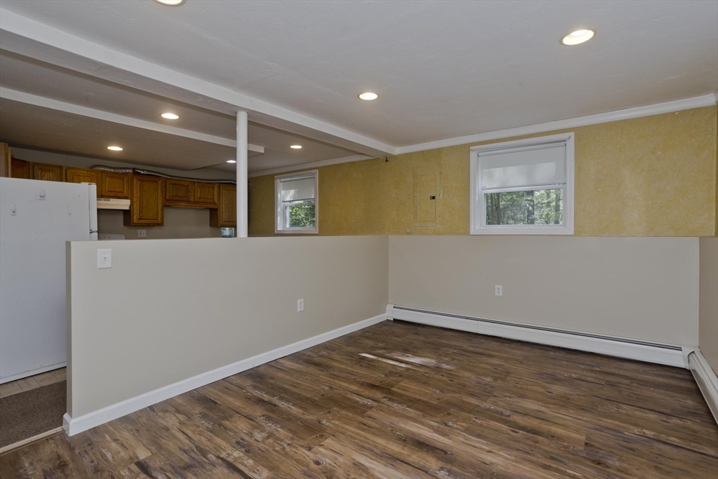 85 Damon Pond Road Chesterfield, MA 01012 - Photo 21 of 42 a view of an empty room with wooden floor and a window