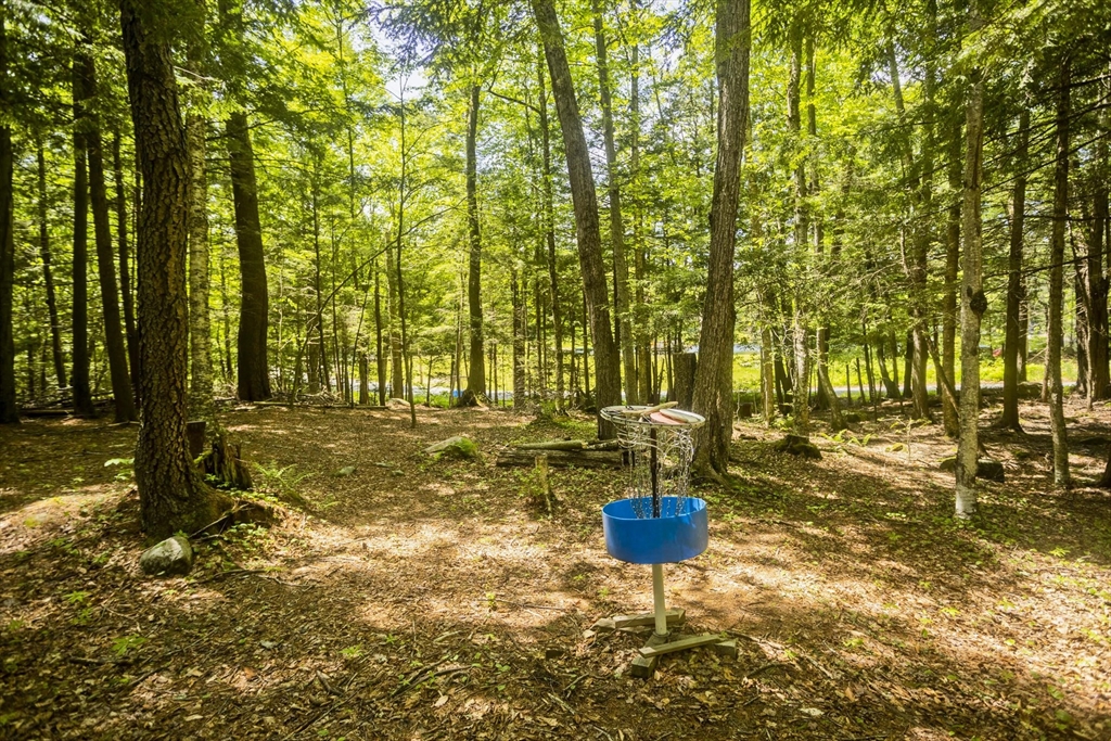 85 Damon Pond Road Chesterfield, MA 01012 - Photo 35 of 42 a swimming pool with outdoor seating and yard