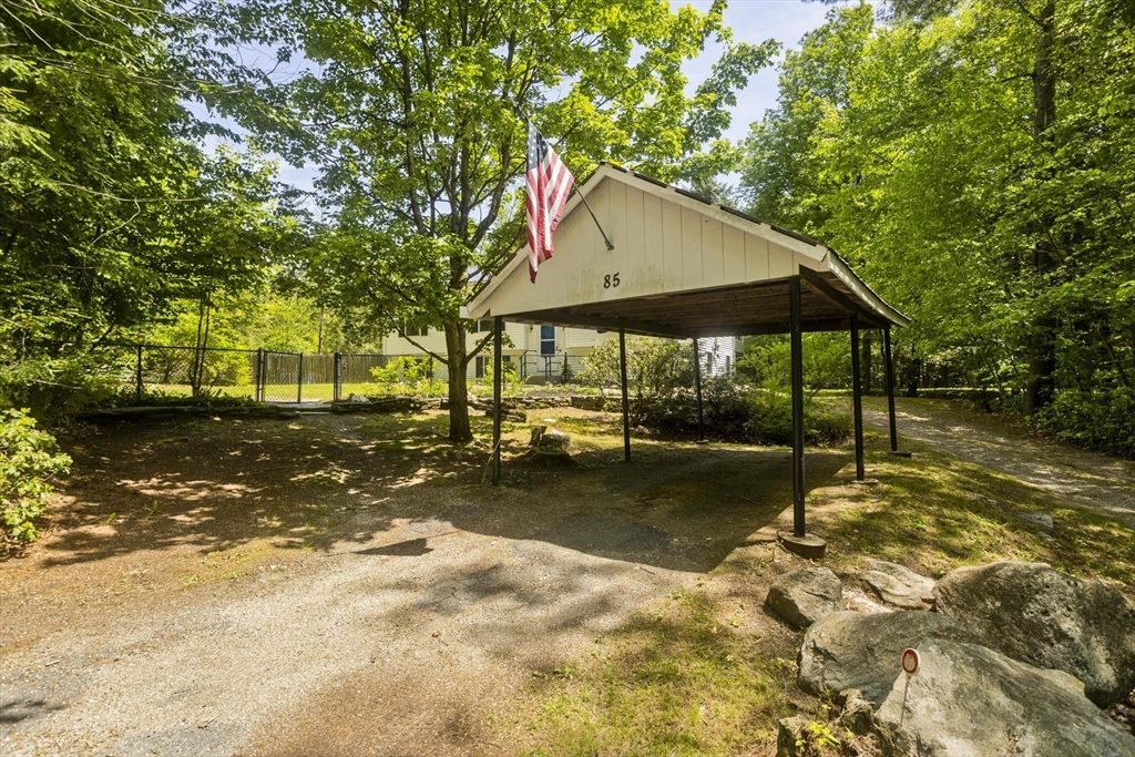 85 Damon Pond Road Chesterfield, MA 01012 - Photo 4 of 42 a view of a wooden house with a yard