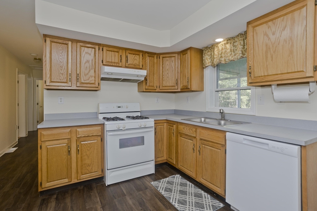 85 Damon Pond Road Chesterfield, MA 01012 - Photo 8 of 42 a kitchen with stainless steel appliances granite countertop a sink a stove cabinets and wooden floor