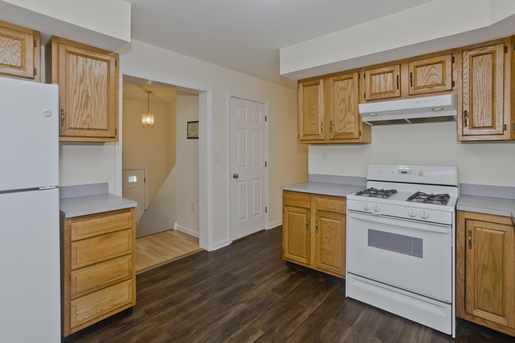 85 Damon Pond Road Chesterfield, MA 01012 - Photo 9 of 42 a kitchen with a stove and wooden floor