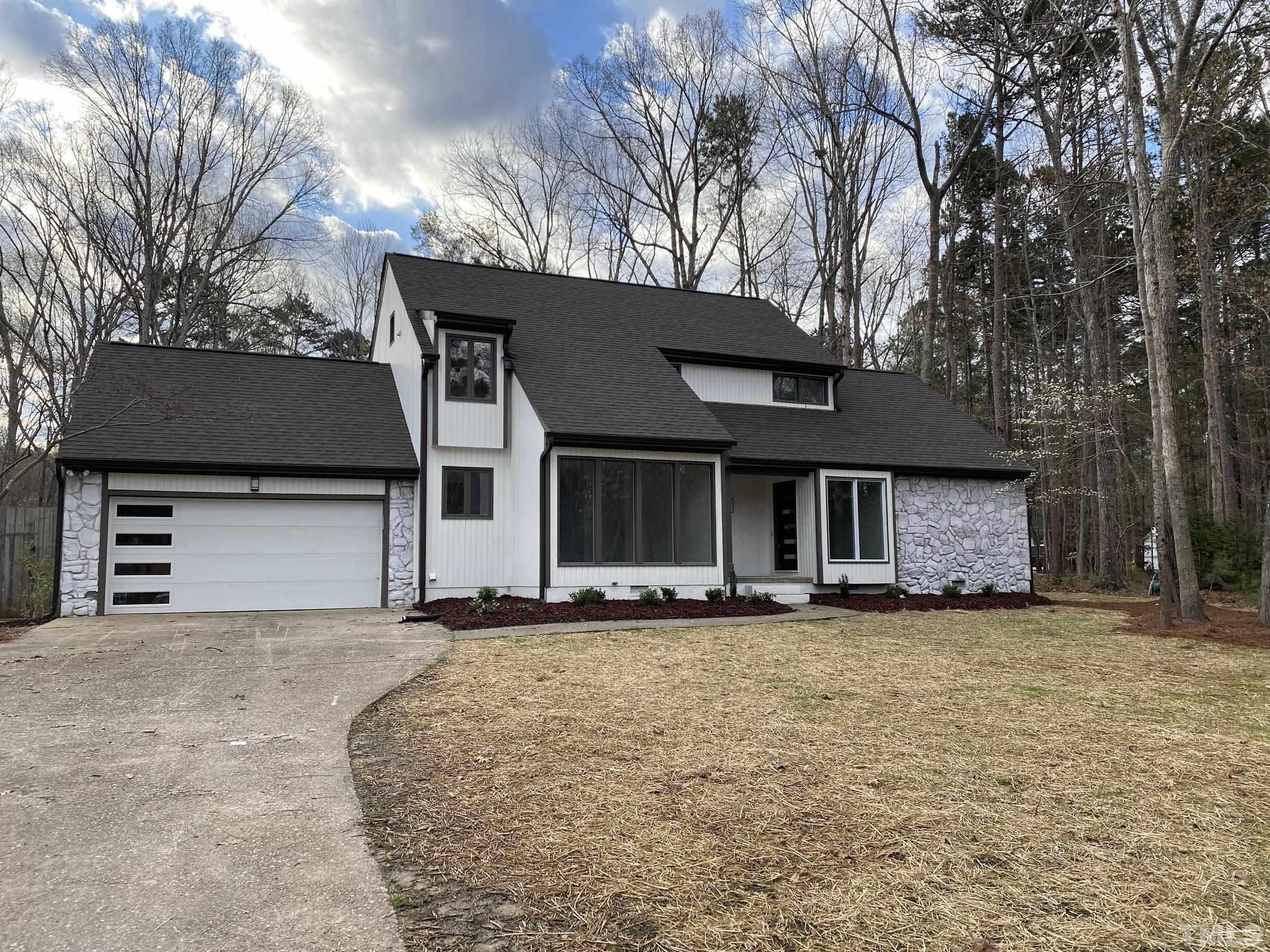 11004 Harness Circle Raleigh, NC 27614 - Photo 1 of 23 a front view of a house with a yard