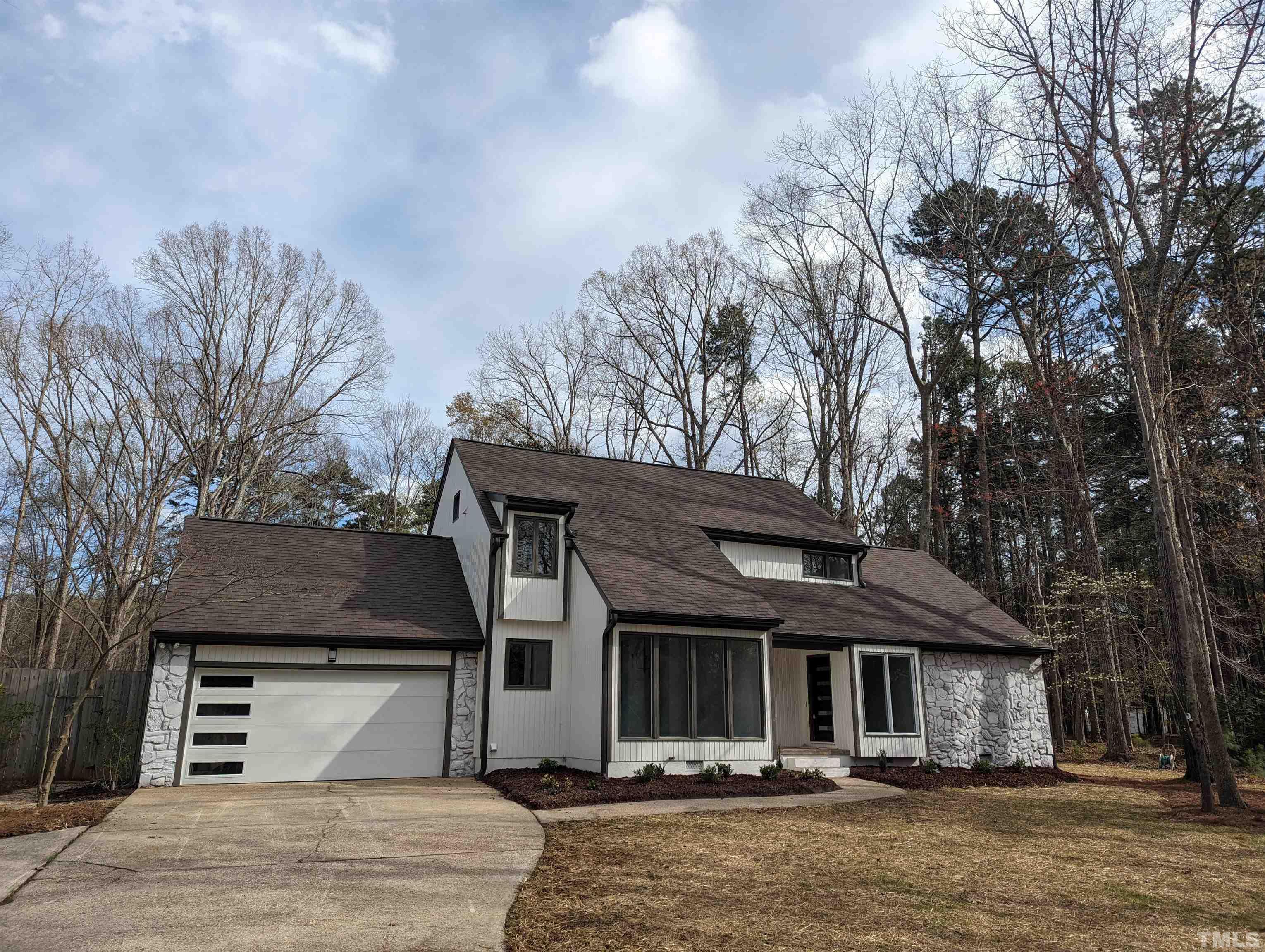 11004 Harness Circle Raleigh, NC 27614 - Photo 20 of 23 a front view of a house with garden