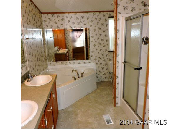465 McKinley Road Middlebrook, VA 24459 - Photo 18 of 19 a bathroom with a sink a toilet and a mirror