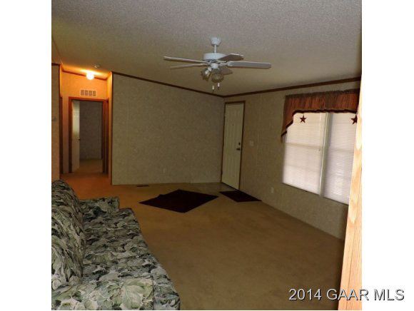 465 McKinley Road Middlebrook, VA 24459 - Photo 8 of 19 a bedroom with a bed and a chandelier