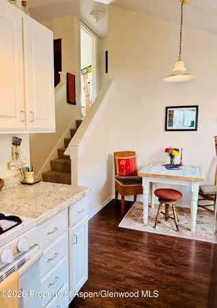 a view of kitchen island with furniture and wooden floor