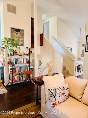 a living room with furniture and a rug
