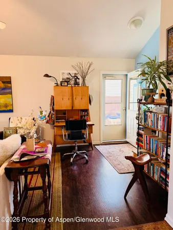 a workspace with furniture and a potted plant