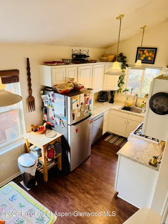 a utility room with sink dryer and washer