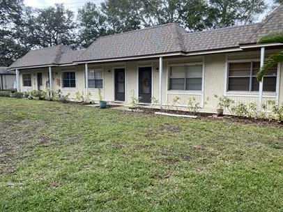 a front view of a house with yard