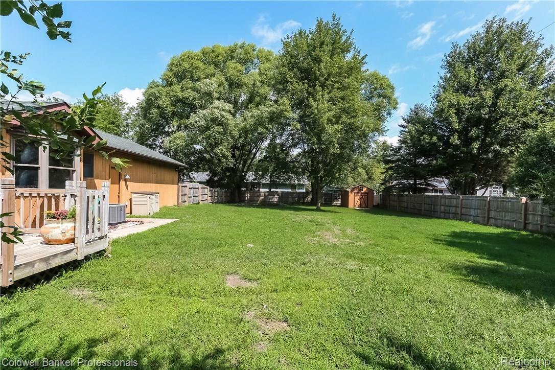 15485 Elwell Road Belleville, MI 48111 - Photo 23 of 27 Back Yard Surrounded by a Privacy Fence