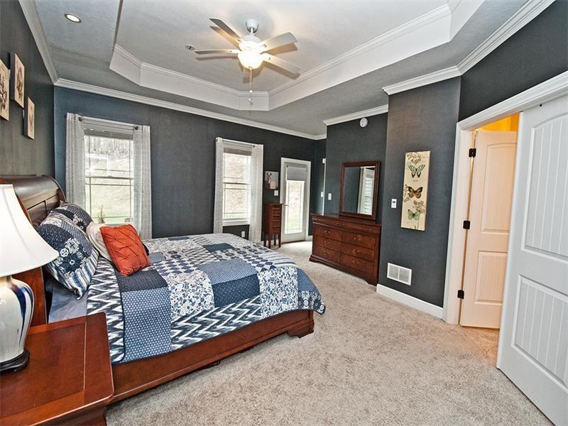 1763 Old State Road Gibsonia, PA 15044 - Photo 12 of 25 GORGEOUS 1st floor MSTR Suite accented w/a tray ceiling, ceiling fan w/light, crown molding, recessed lighting, 2 walk-in closets, large windows, door leading out to the private backyard & a LUXURIOUS Ensuite.