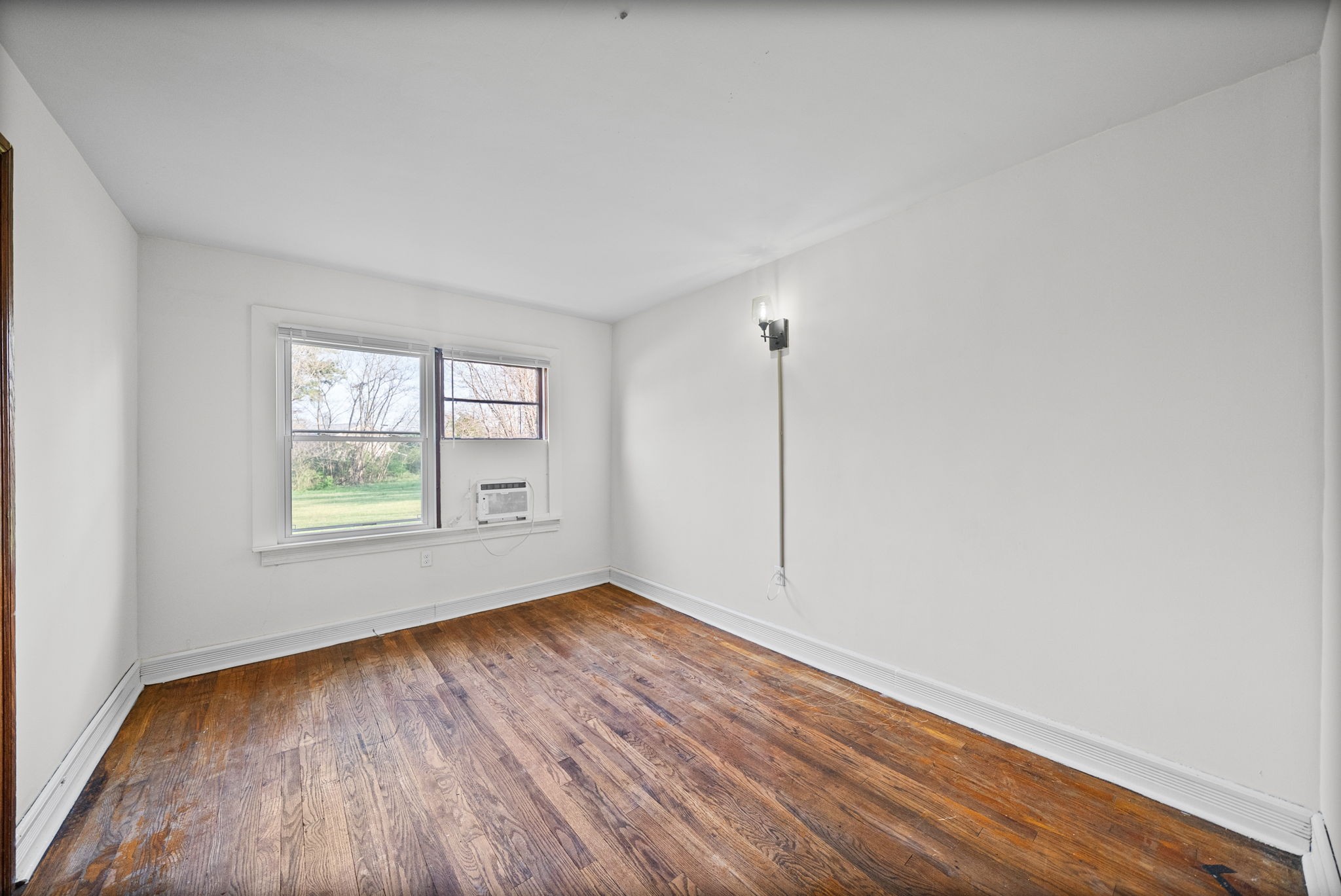 420 Lafayette Road, Unit A Clarksville, TN 37042 - Photo 20 of 25 a view of an empty room with wooden floor and a window