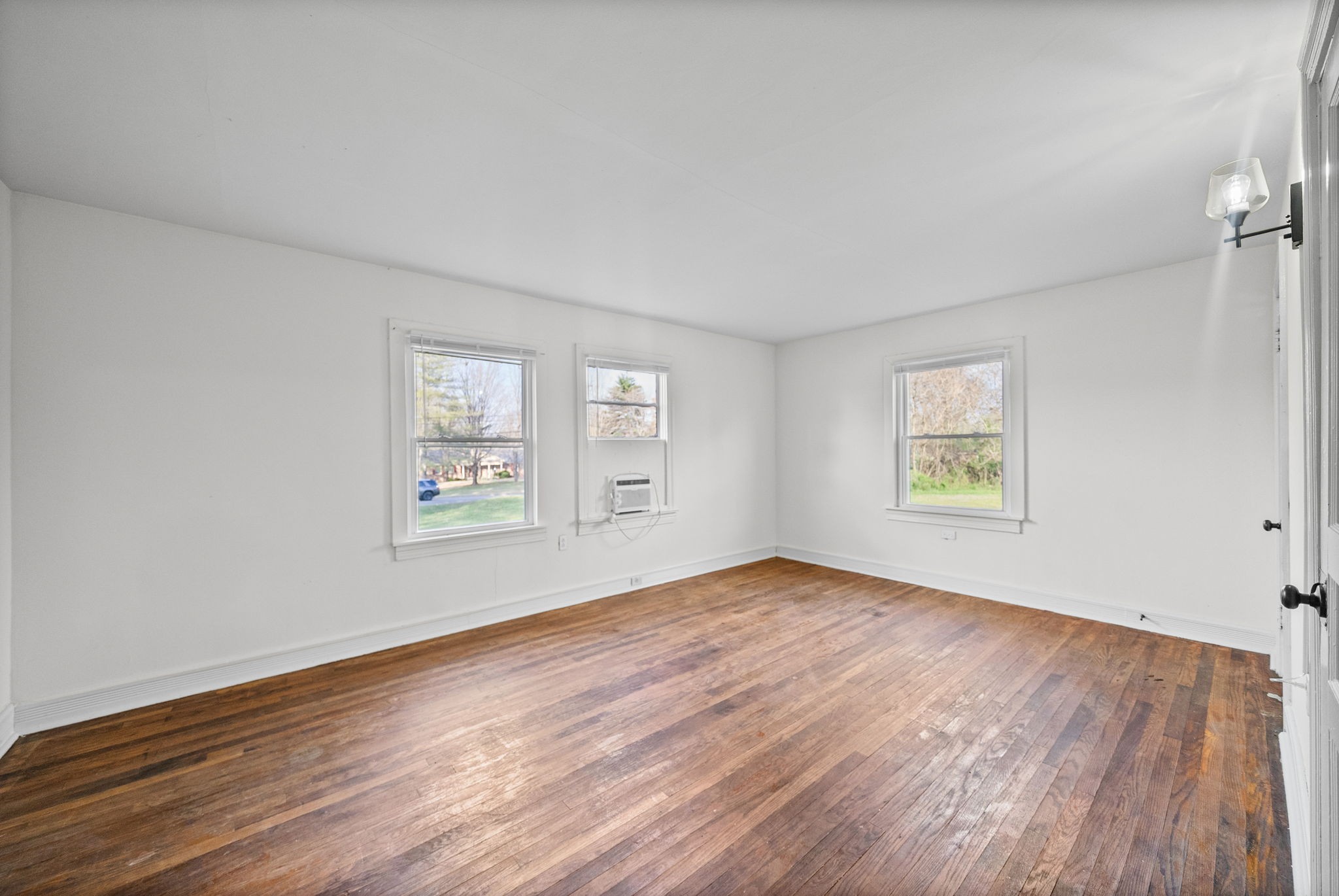 420 Lafayette Road, Unit A Clarksville, TN 37042 - Photo 22 of 25 an empty room with wooden floor and windows