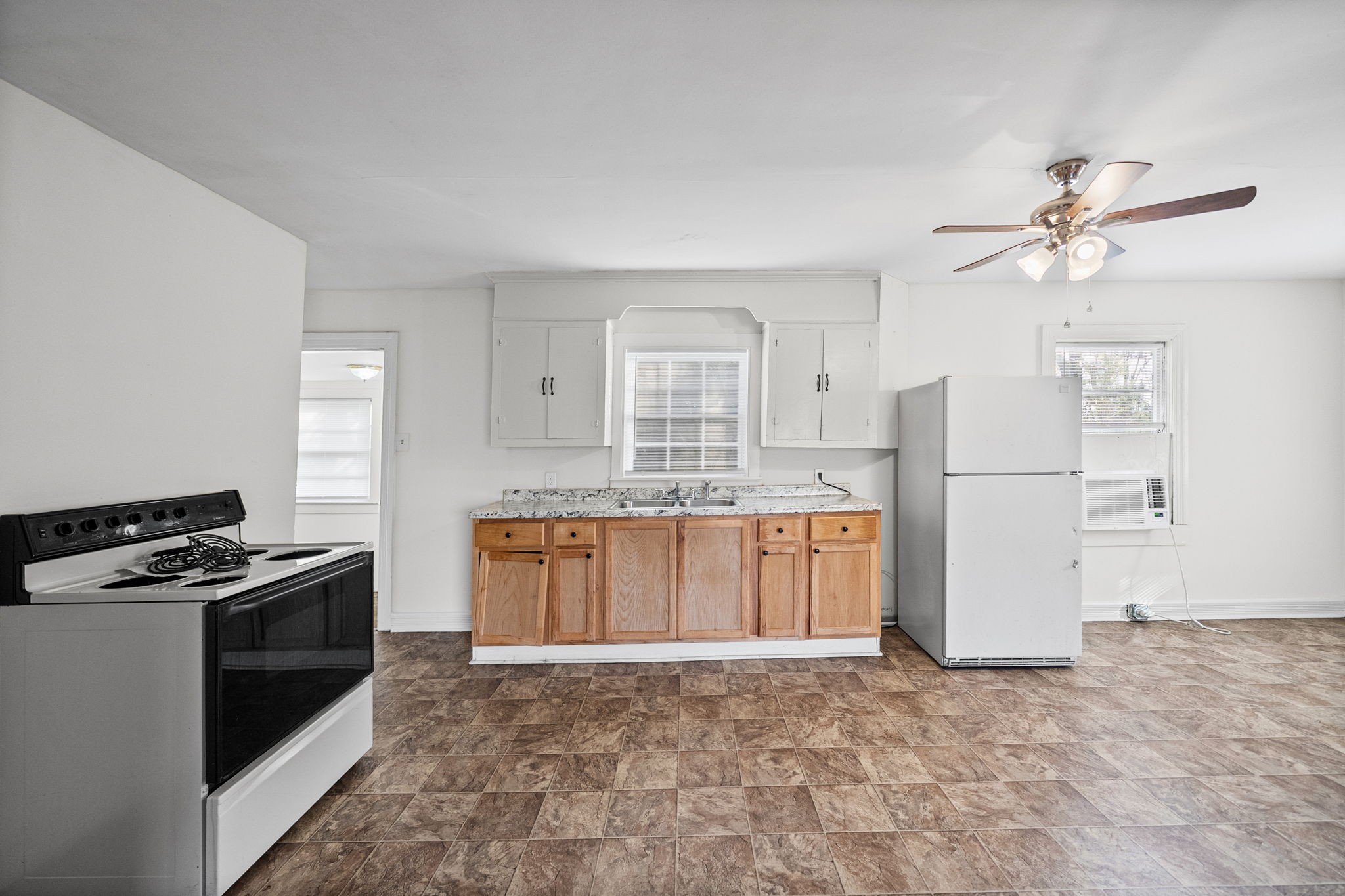 420 Lafayette Road, Unit A Clarksville, TN 37042 - Photo 10 of 25 a kitchen with stainless steel appliances granite countertop a stove a refrigerator and a sink with granite countertops