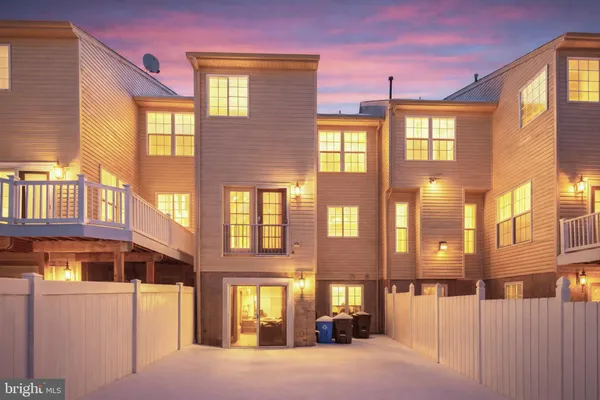 a front view of a building with a lot of windows