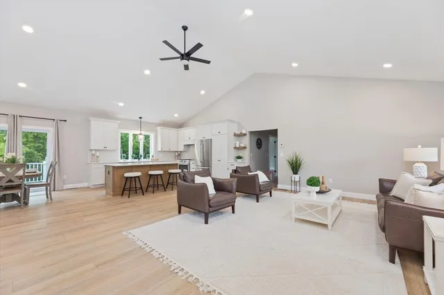 a living room with furniture a window and appliances