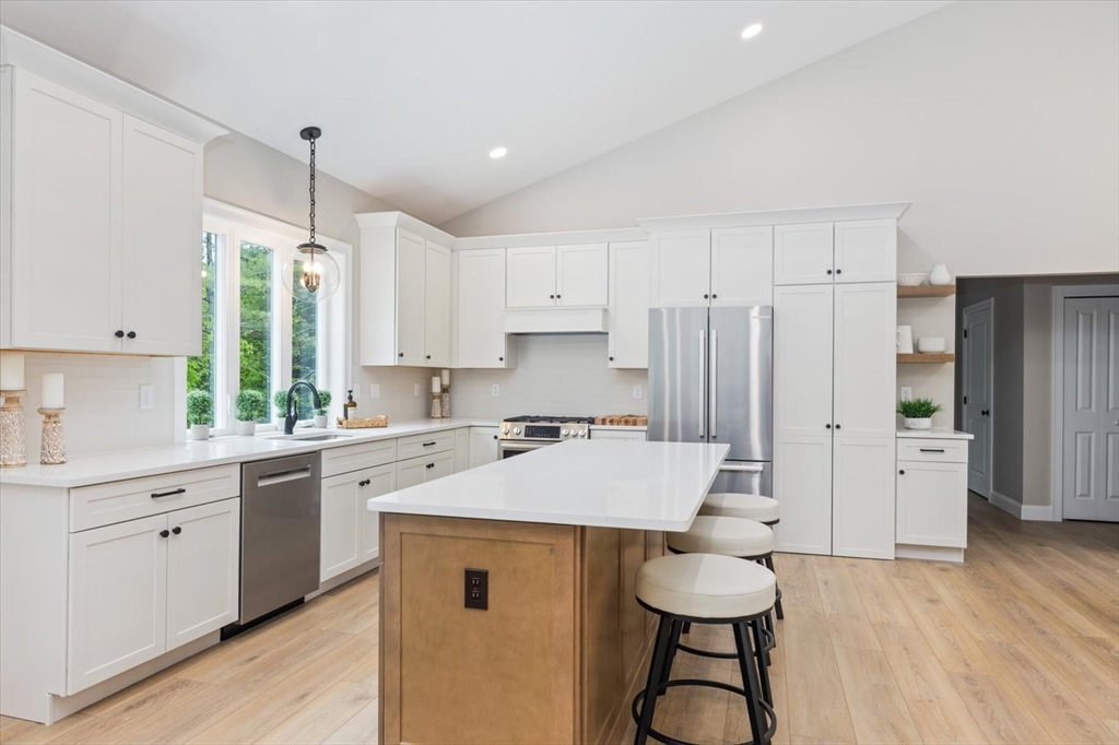 25-2 Sunset Road Westminster, MA 01473 - Photo 18 of 41 a kitchen with a sink a stove a refrigerator and white cabinets