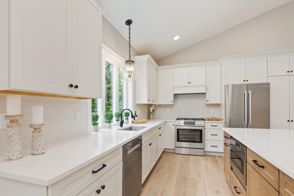 25-2 Sunset Road Westminster, MA 01473 - Photo 23 of 41 a kitchen with a sink a counter top space stainless steel appliances and cabinets