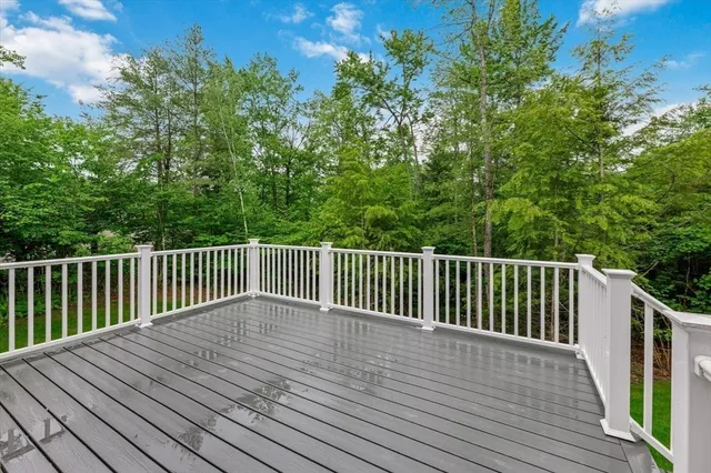a view of deck with wooden floor and fence