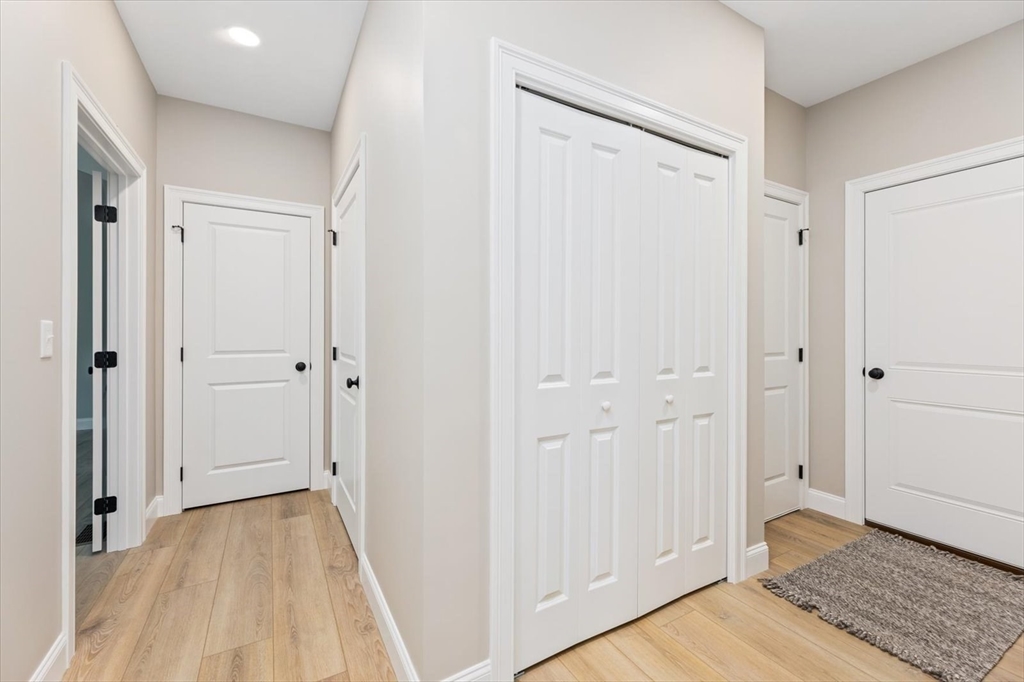25-2 Sunset Road Westminster, MA 01473 - Photo 34 of 41 a view of a hallway with wooden floor