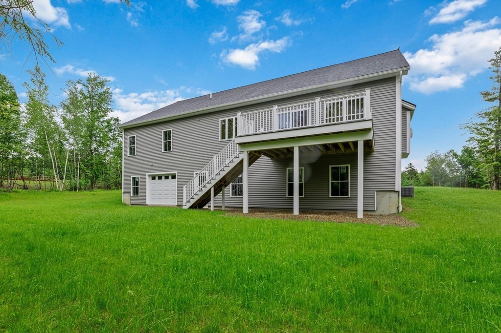 25-2 Sunset Road Westminster, MA 01473 - Photo 8 of 41 a view of a house with a yard and sitting area