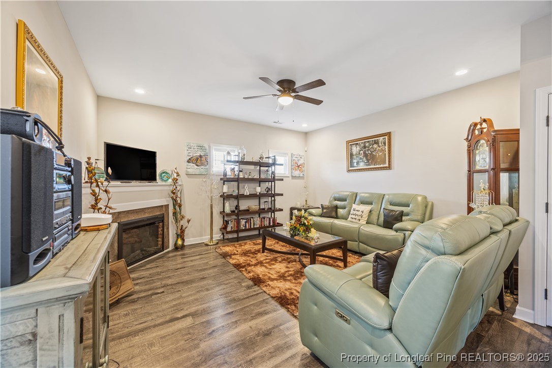 911 Townsend Road Raeford, NC 28376 - Photo 18 of 46 a living room with furniture a flat screen tv and a fireplace