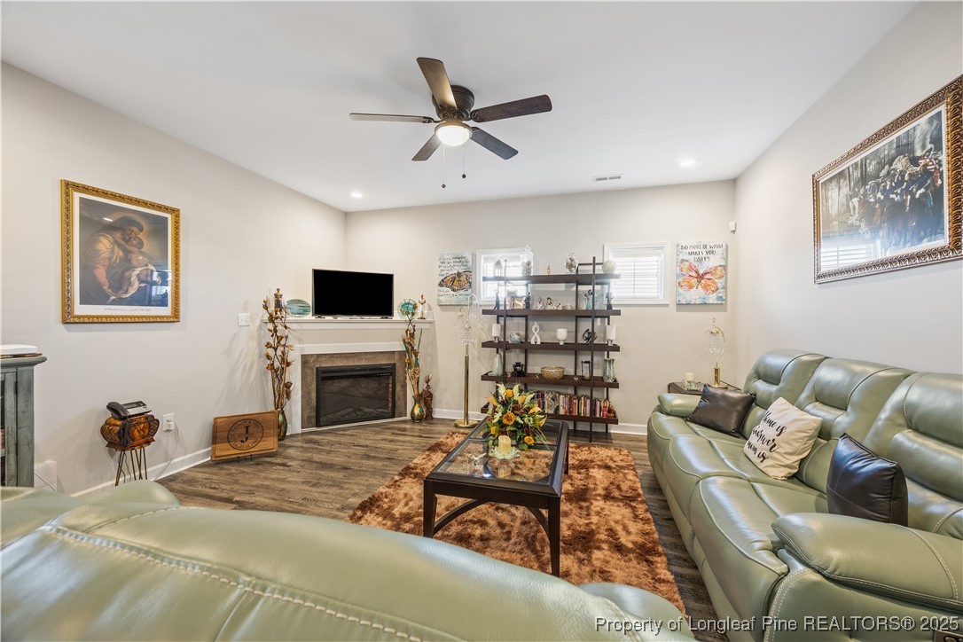 911 Townsend Road Raeford, NC 28376 - Photo 20 of 46 a living room with furniture and a fireplace