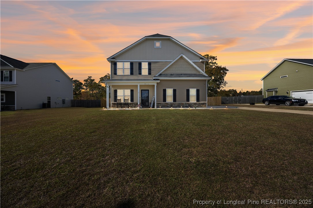 911 Townsend Road Raeford, NC 28376 - Photo 2 of 46 a front view of a house with a garden