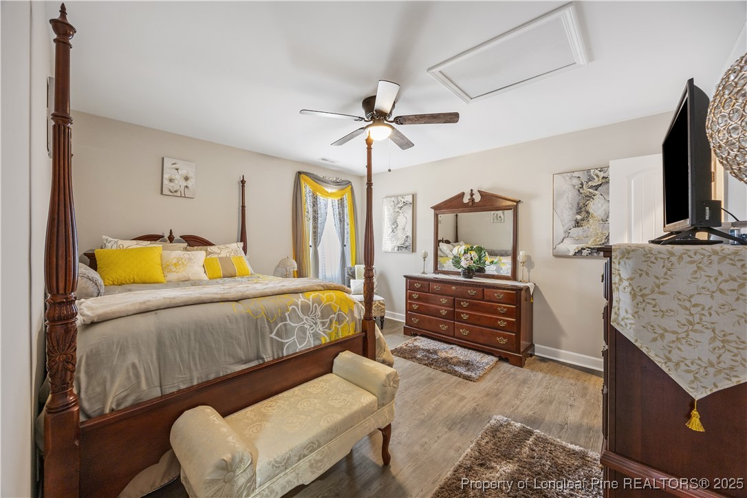 911 Townsend Road Raeford, NC 28376 - Photo 22 of 46 a bedroom with a bed and dresser with mirror