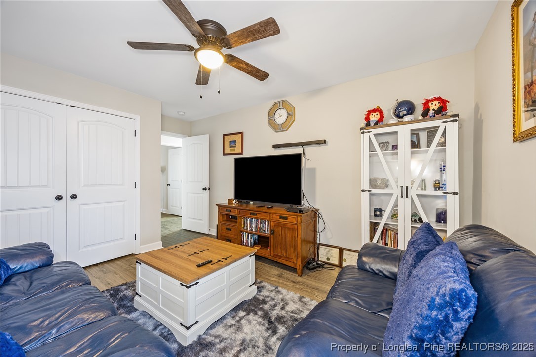 911 Townsend Road Raeford, NC 28376 - Photo 26 of 46 a living room with furniture and a flat screen tv