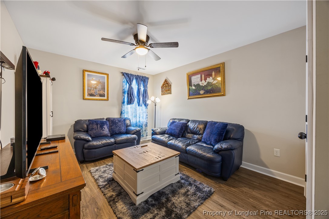 911 Townsend Road Raeford, NC 28376 - Photo 28 of 46 a living room with furniture and a flat screen tv