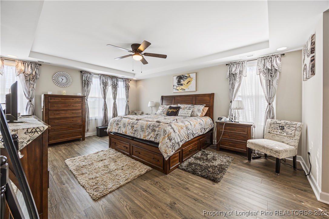 911 Townsend Road Raeford, NC 28376 - Photo 30 of 46 a bedroom with a bed a couch and a dresser