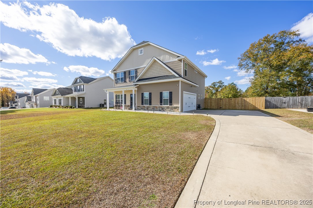 911 Townsend Road Raeford, NC 28376 - Photo 3 of 46 a front view of a house with a yard