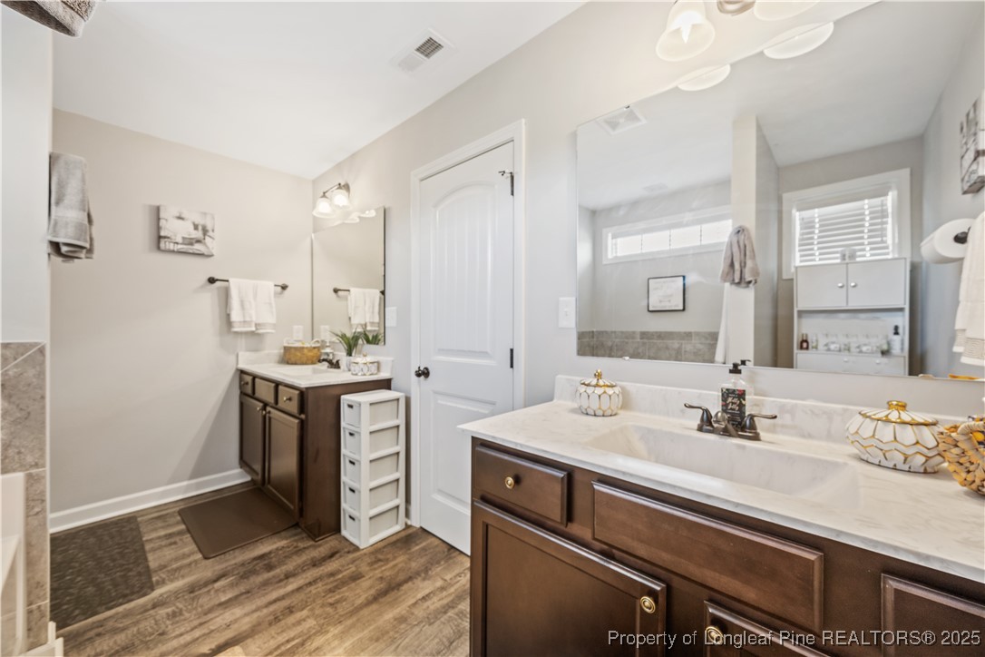 911 Townsend Road Raeford, NC 28376 - Photo 33 of 46 a bathroom with a sink double vanity and a mirror