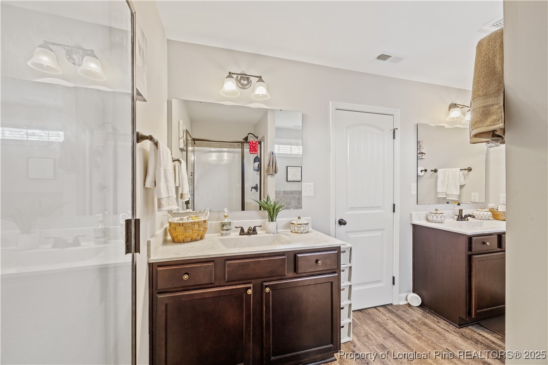 911 Townsend Road Raeford, NC 28376 - Photo 34 of 46 a bathroom with a sink vanity granite tub and shower