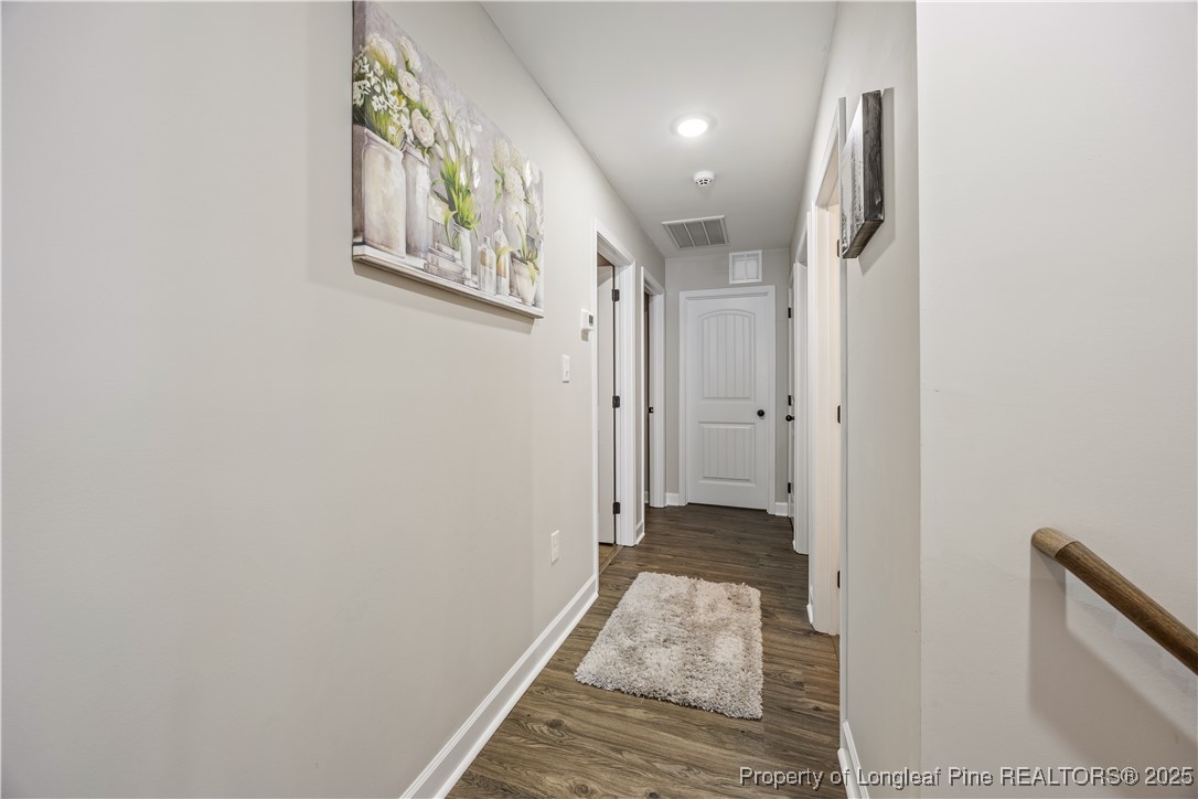 911 Townsend Road Raeford, NC 28376 - Photo 36 of 46 a view of hallway with wooden floor