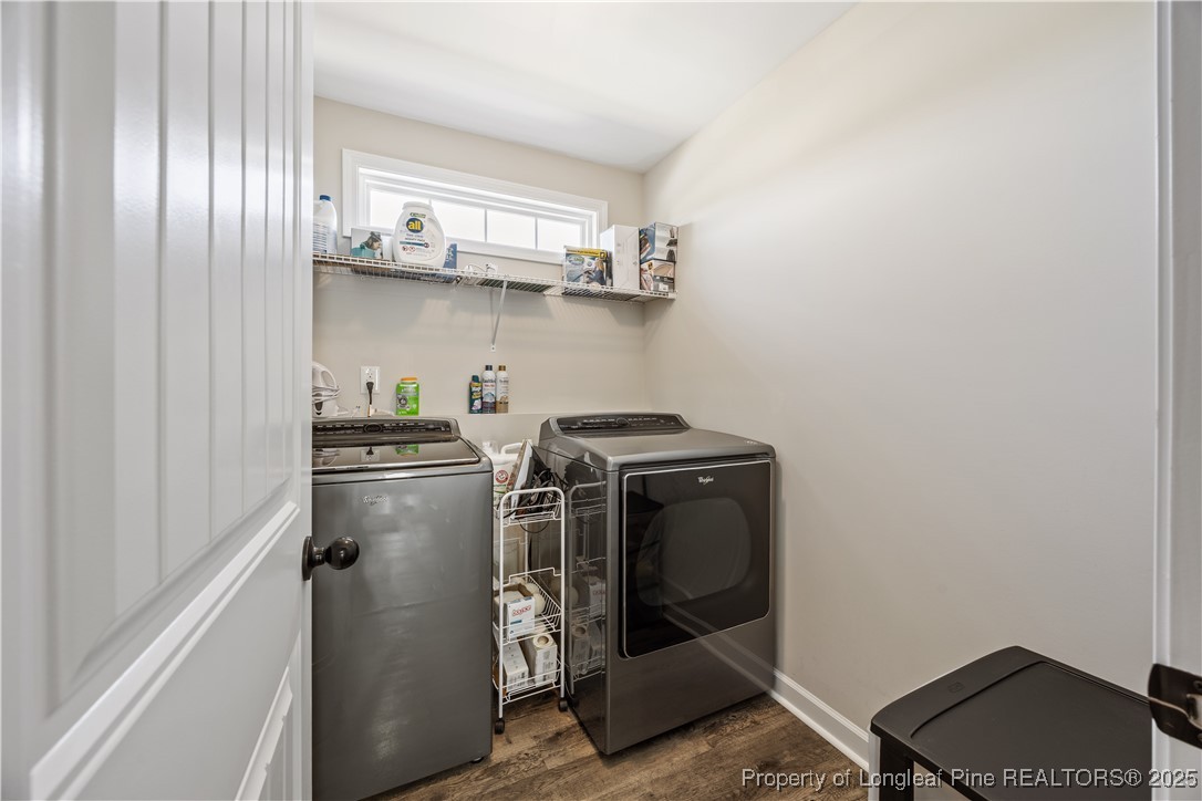 911 Townsend Road Raeford, NC 28376 - Photo 37 of 46 a utility room with stainless steel appliances wooden floor and cabinets
