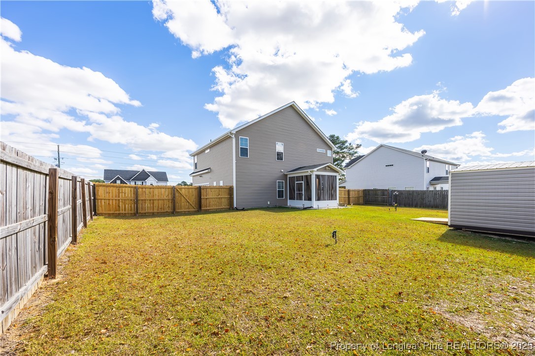 911 Townsend Road Raeford, NC 28376 - Photo 40 of 46 a house view with swimming pool and wooden fence