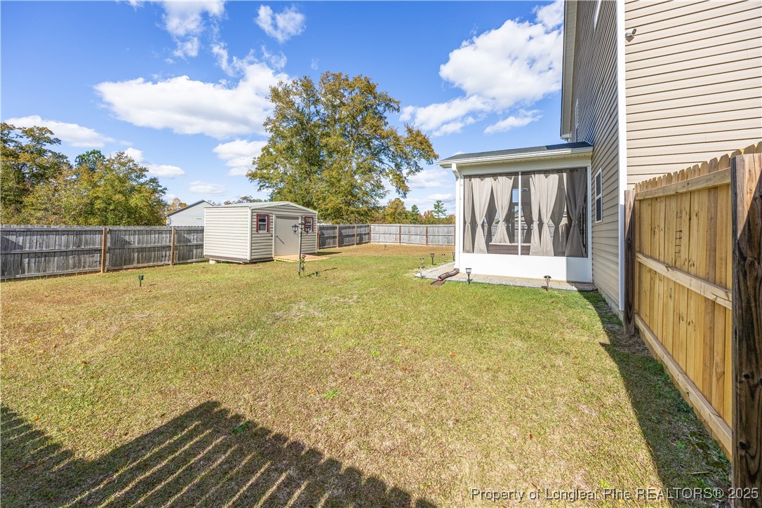 911 Townsend Road Raeford, NC 28376 - Photo 42 of 46 a view of a house with backyard and sitting area