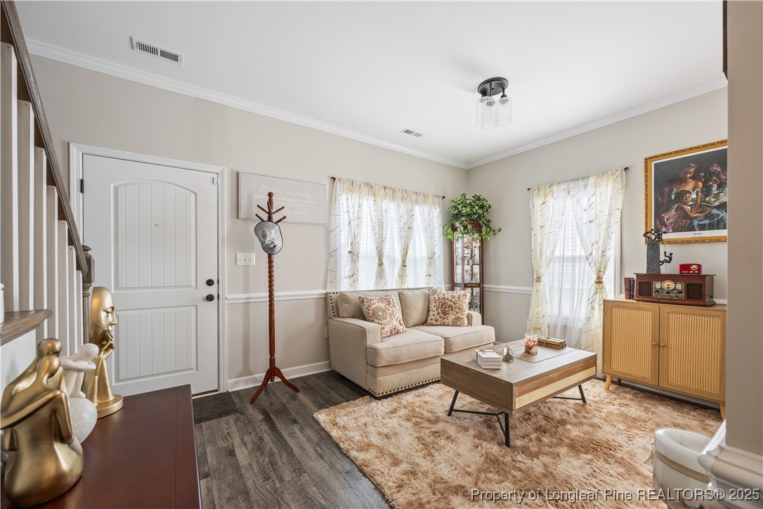 911 Townsend Road Raeford, NC 28376 - Photo 5 of 46 a living room with furniture and a wooden floor