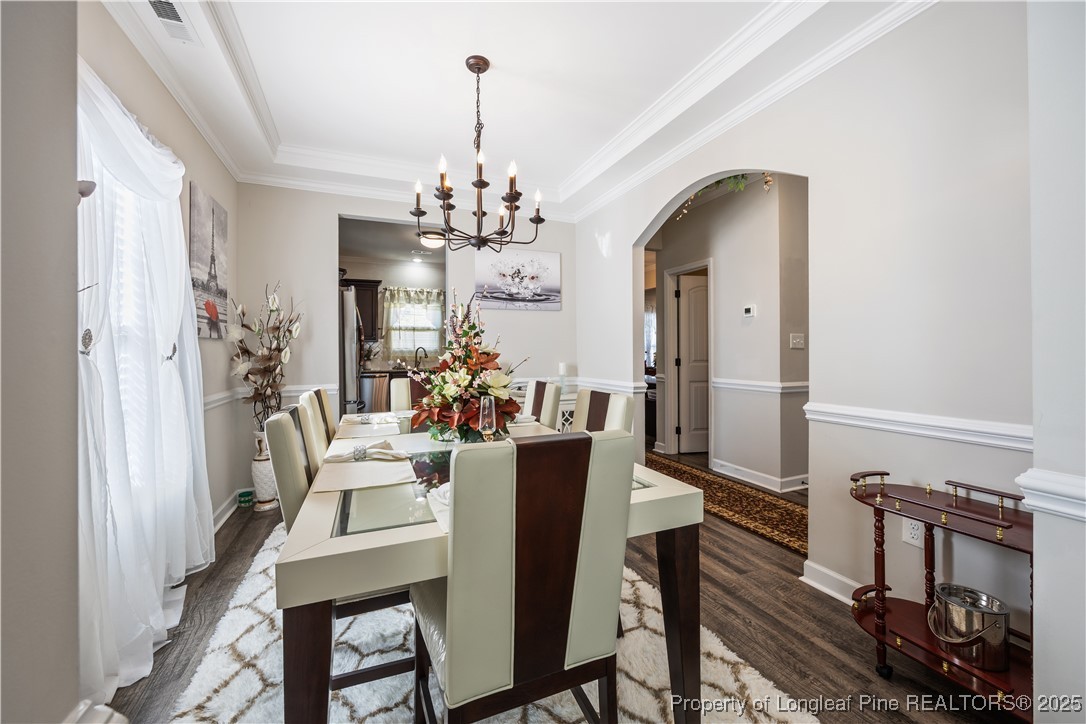 911 Townsend Road Raeford, NC 28376 - Photo 8 of 46 a view of a dining room with furniture and a chandelier