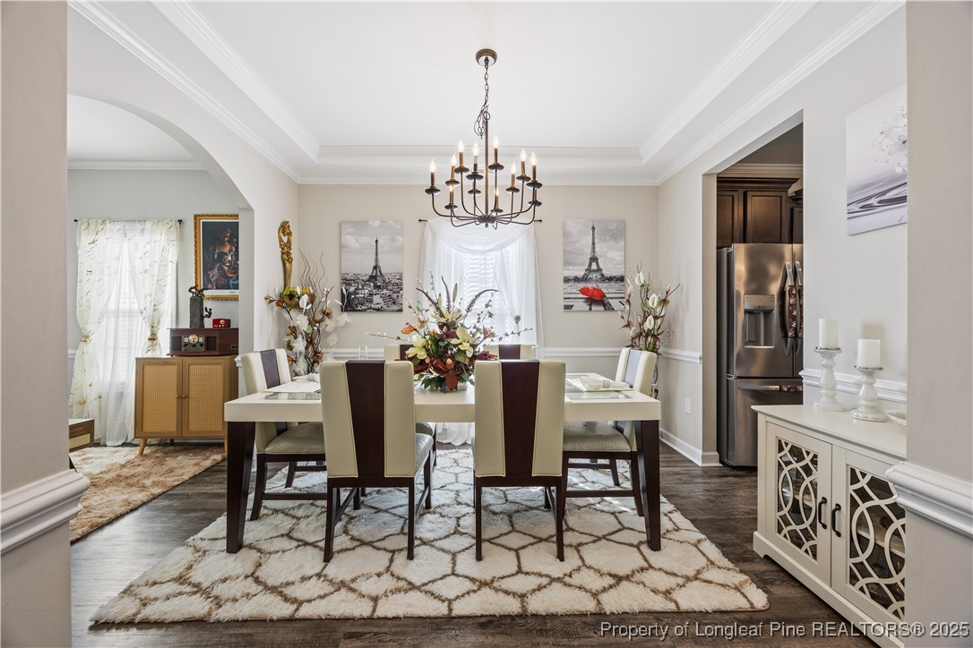 911 Townsend Road Raeford, NC 28376 - Photo 9 of 46 a view of a dining room with furniture and chandelier